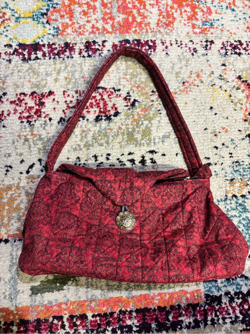 Quilted Red Pattern Shoulder Bag with Decorative Medallion